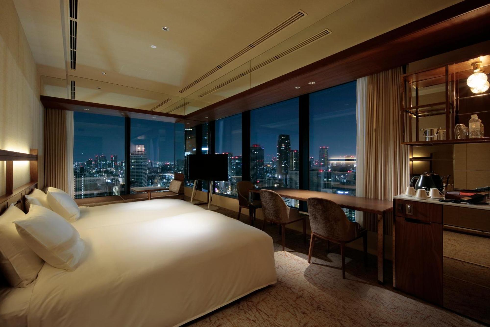 Candeo Hotels Osaka The Tower Quarto foto A bedroom at the hotel